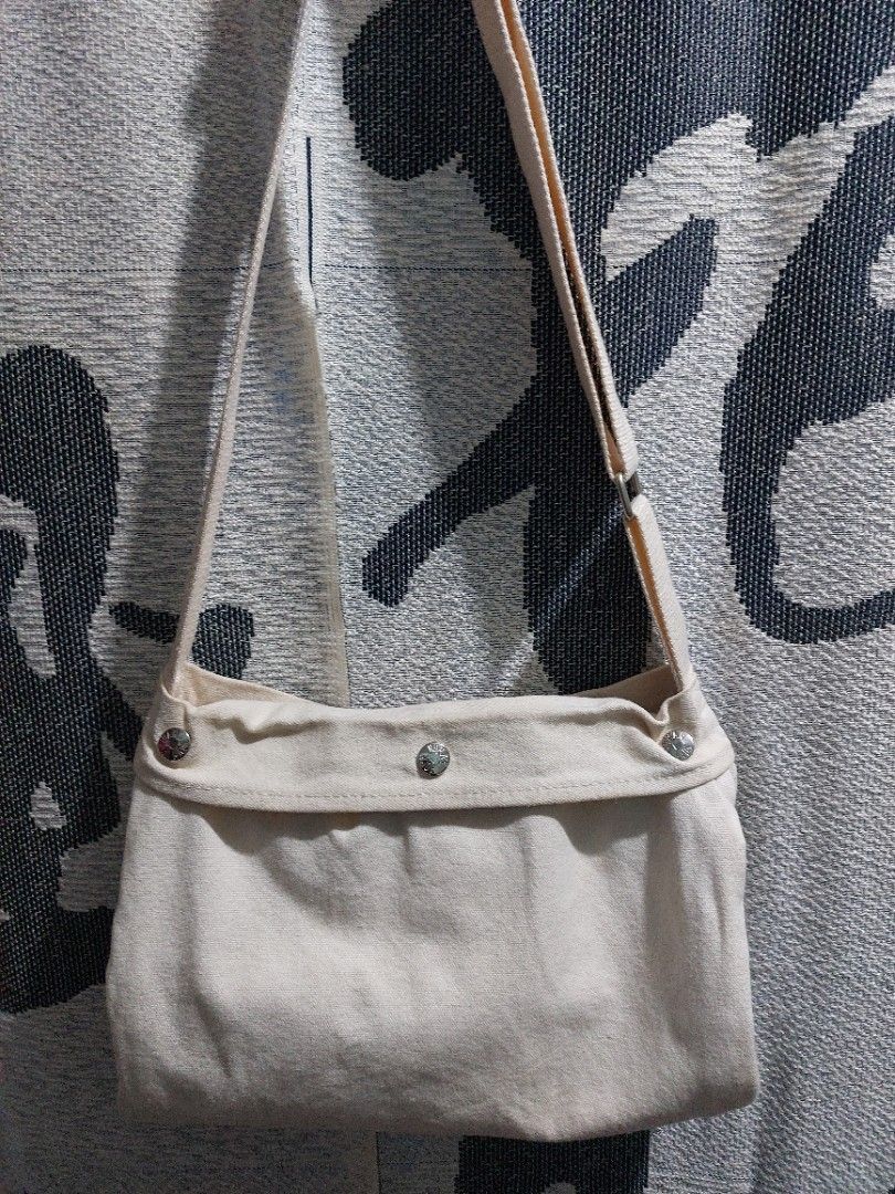 Human Made Crossbody Bag (Category: Sling Bags) located in Muntinlupa City. Submitted by sakurambo_des (Listing ID 1241894348, Image 3). Description: Strmcwby❤️ Human Made Crossbody bag Ecru canvas Unisex Lightly used With minimal washable stain 680 only.