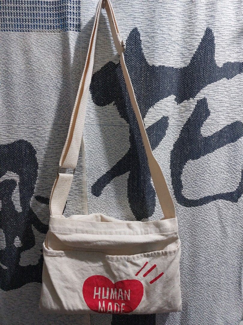 Human Made Crossbody Bag (Category: Sling Bags) located in Muntinlupa City. Submitted by sakurambo_des (Listing ID 1241894348, Image 2). Description: Strmcwby❤️ Human Made Crossbody bag Ecru canvas Unisex Lightly used With minimal washable stain 680 only.