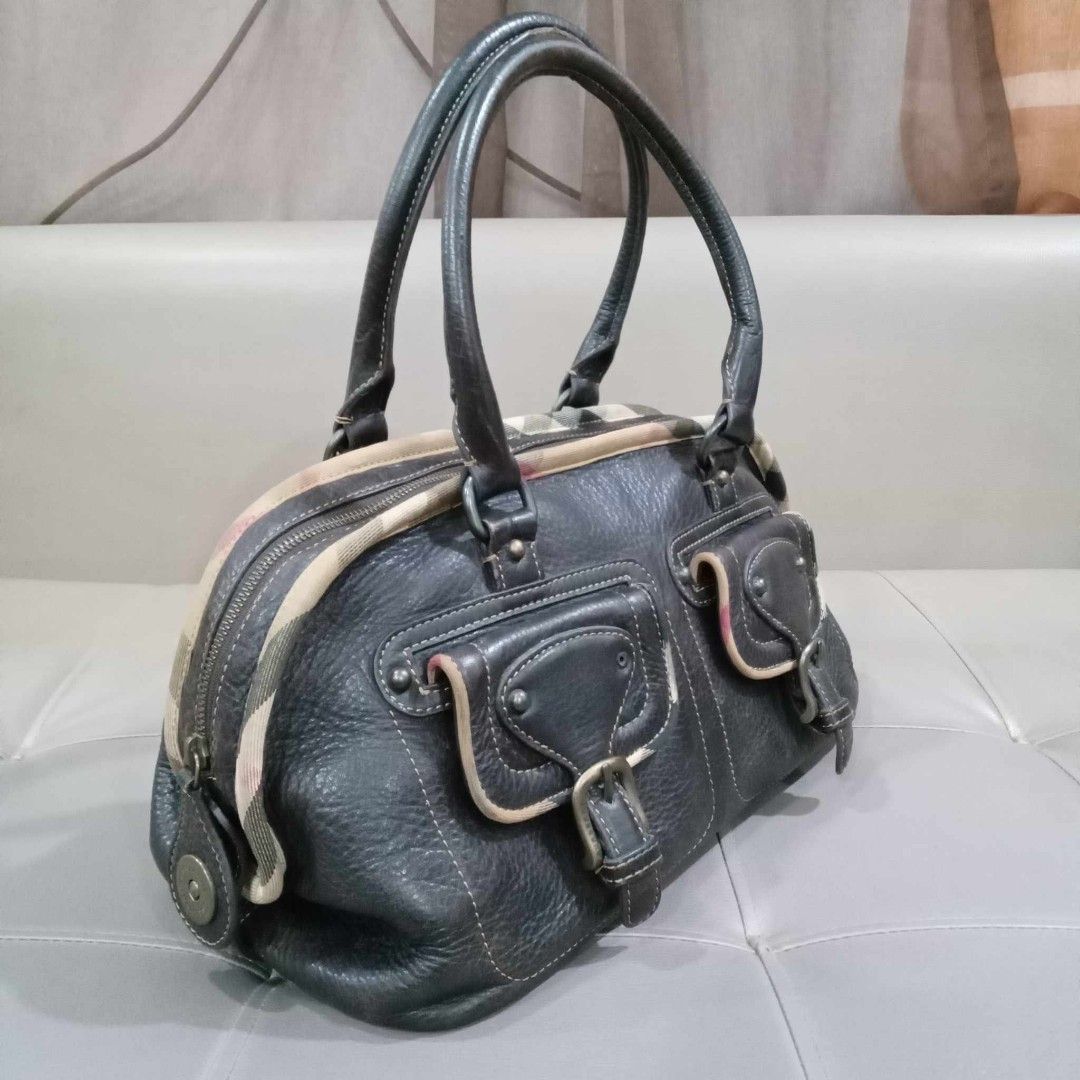 Burberry Brown Boston Type Bag (Category: Luxury Bags & Wallets) located in Taguig. Submitted by esa.agustin (Listing ID 1242029037, Image 2). Description: Original Burberry browm leather boston type shoulder bag. With dust bag. Measurement: Height - 7 inches; Length- 13.3 inches; Width - 8.6 inches.