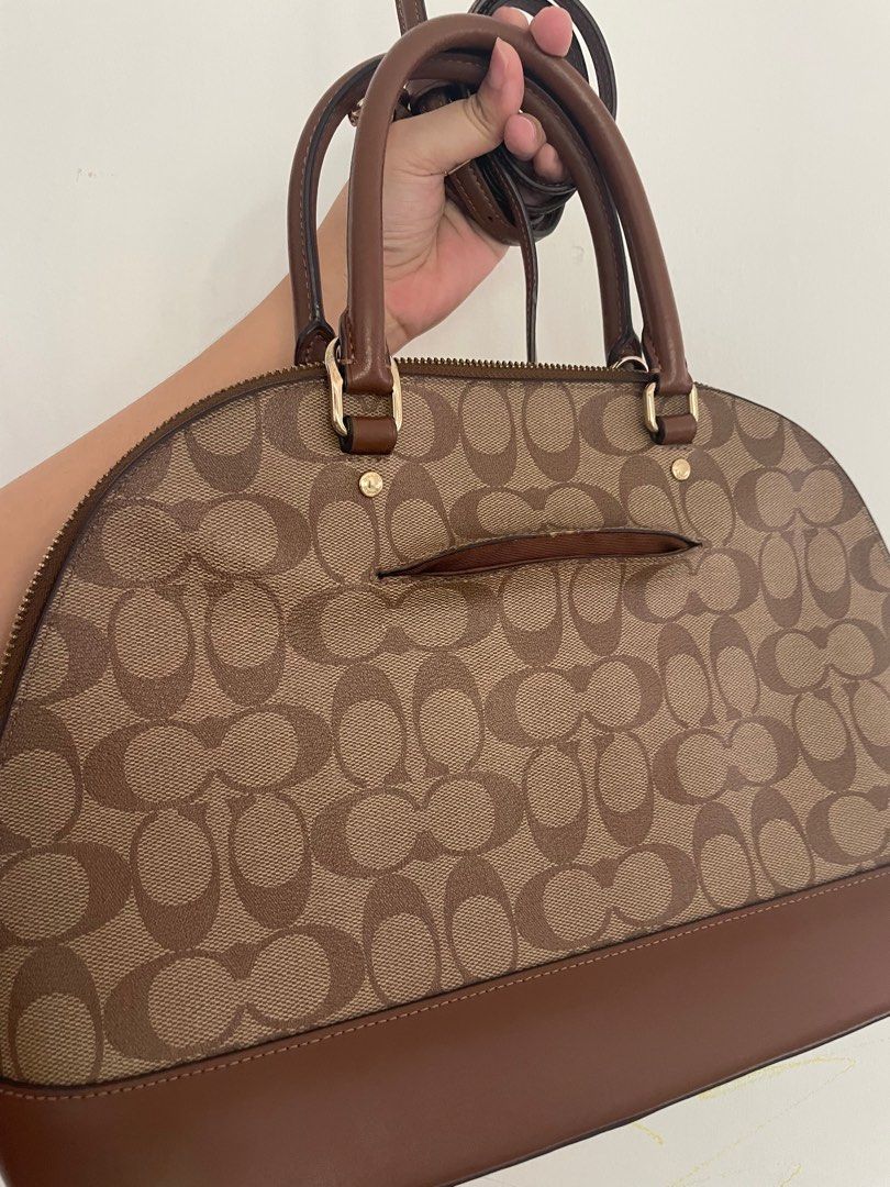 Authentic Coach Katy Satchel (Pre-loved) (Category: Luxury Bags & Wallets) located in San Fernando. Submitted by akcd12 (Listing ID 1241967812, Image 3). Description: Product Details: ✨100% authentic ✨Lightly used ✨comes with free auth coach keychain ✨ with detachable strap Signature coated canvas and smooth leather Inside zip pocket Zip closure, fabric lining Handles with 3 3/4” drop Outside zip pocket Detachable strap with 22” drop for shoulder