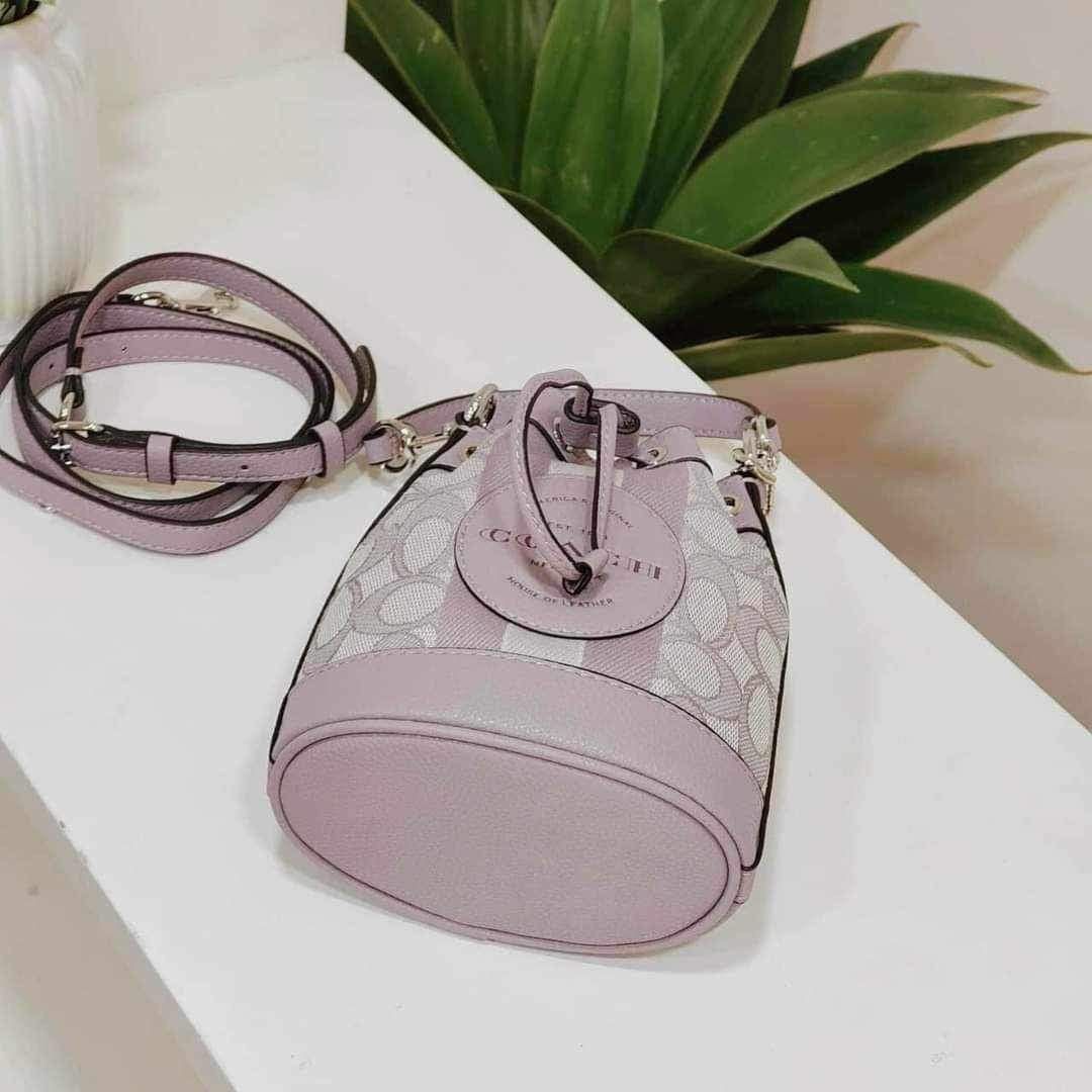 Coach Mini Dempsey Bucket Bag (Category: Luxury Bags & Wallets) located in Rizal. Submitted by LuxbyMarifrance (Listing ID 1241947615, Image 2). Description: 🏷️ 2,400 only + SF 💼 COACH MINI DEMPSEY BUCKET BAG IN SIGNATURE JACQUARD WITH STRIPE AND COACH PATCH 📏 51/2” (L) × 6 1/2” (H) × 3 1/2” (W) 📌 with dust bag and paper bag ✨All trademarks, logos and brand names are reserved and property of the original brand owners. #coachph #authenticquali