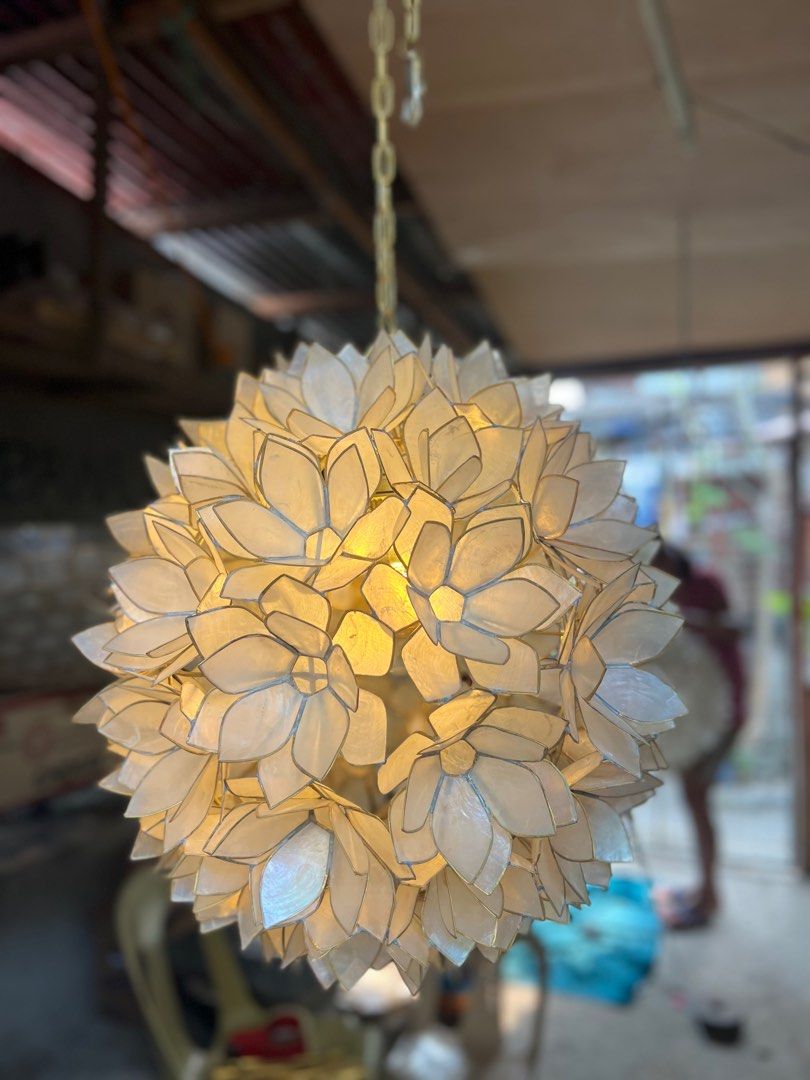 Lotus capiz pendant light (Category: Lighting) located in Caloocan City. Submitted by casadisenyo (Listing ID 1242063901, Image 2). Description: MADE TO ORDER LEAD TIME: 10-15days after downpayment LOTUS CAPIZ PENDANT LIGHT SIZE: 18" We customized other design & size of capiz chandeliers Message me for inquiries .