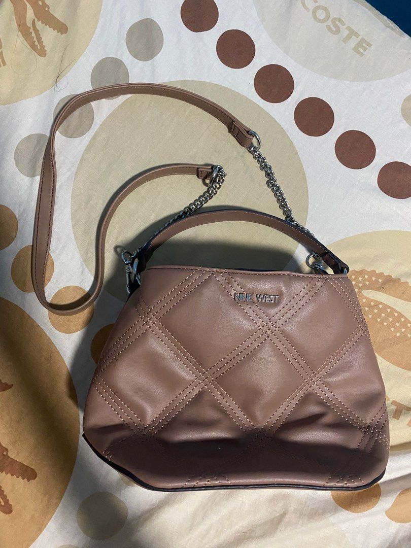 Nine west body bag (Category: Luxury Bags & Wallets) located in Pasig City. Submitted by cjdlcmp (Listing ID 1242065120, Image 2). Description: Original nine west. Used twice only. Old rose in color.