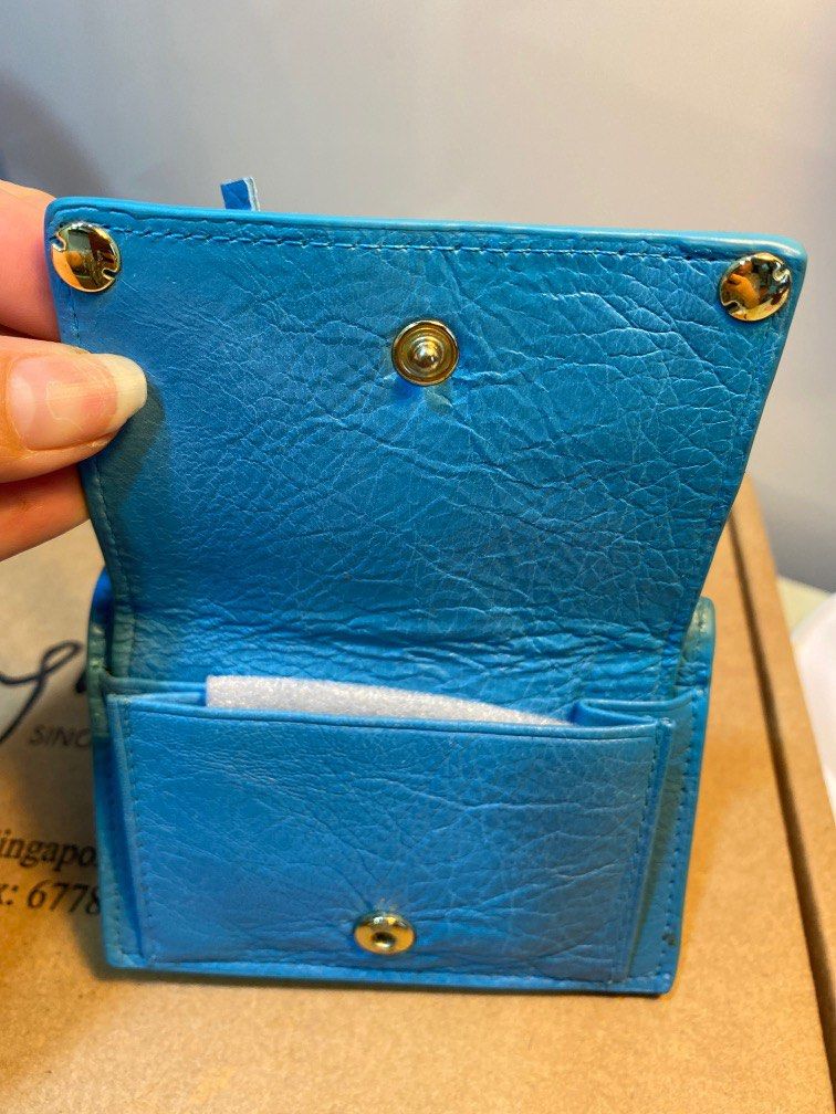 Wallet (Category: Wallets & Card Holders) located in Singapore. Submitted by luxjoy (Listing ID 1241999749, Image 3). Description: Jeans blue mini wallet with notes, coin and small zip enclosure in distressed soft leather Dimensions 10x7x4cm Wallet opens up to 20cm and can fit 50.00 note comfortably Strictly meet up at my location. Courier available at 4.30 payable by buyer.