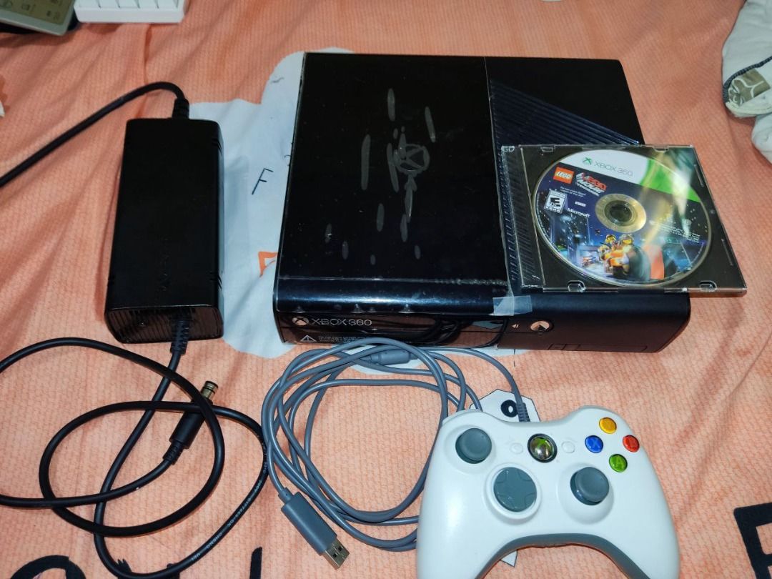 XBOX 360 E (last/latest X360 model) (Category: Xbox) located in Marilao. Submitted by calibre027 (Listing ID 1242072548, Image 2). Description: XBOX 360 E (last/latest 360 model) 🔥 NO ISSUE, all working, sobrang slightly used ginamit lang pang forza 🔥 intact pa plastic, warranty seals never opened, rubber feet complete 🔥 pwedeng itest sa area niyo pagusapan nalang natin 🔥 Package: console, 1 wired controller, power brick 220v, lego the movie 