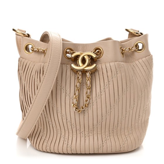 Chanel Crumpled Calfskin Coco Pleats Small Drawstring Bucket Bag Beige,  Women's Fashion, Bags & Wallets, Cross-body Bags on Carousell