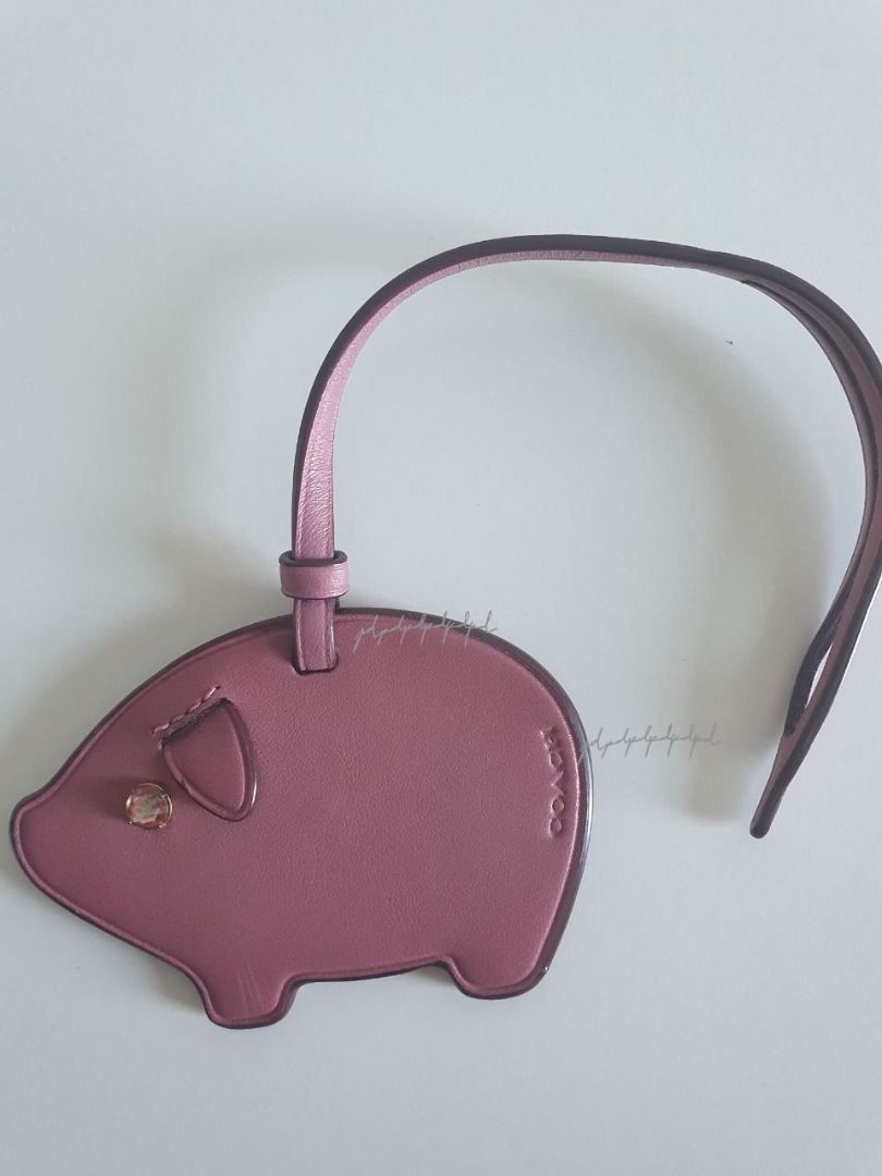 Coach pig bag discount charm