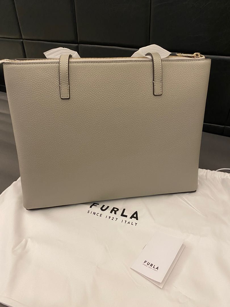 Furla Work Tote Bag (Category: Luxury Bags & Wallets) located in Quezon City. Submitted by joanneluy (Listing ID 1246529623, Image 2). Description: Authentic and legit 💯🇺🇸💯🇺🇸💯🇺🇸 Brand New bought from USA outlet store in San francisco California Furla Italian Brand- Genuine Leather Furla Work Tote 15 inches loptop can fit inside with zipper With dustbag With care card Size : 14x 5 x 10.5.