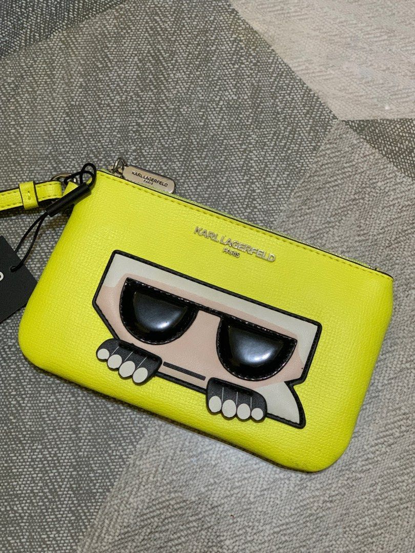 Karl Lagerfeld Maybelle Wristlet Pouch (Category: Purses & Pouches) located in Tagaytay City. Submitted by royal.rawrmeow (Listing ID 1246558105, Image 1). Description: Karl Lagerfeld’s pouch has vibrancy and allure. Styled to attract attention, it features the iconic ‘Maybelle’ graphic on the front to entice lovers of the brand. Top zip closure Silvertone hardware Lining: Textile Synthetic Imported SIZE Synthetic handle, 7” drop 10”W x 5.5”H x 0