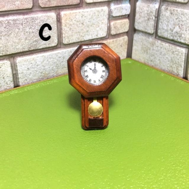Miniature Wall Clock (Category: Clocks) located in Pasig City. Submitted by paisleybox (Listing ID 1246507401, Image 3). Description: Miniature 1/12 scale Wall Clock A. 200 ea- Brown & black round (D- 3.3cm) B. 300 ea- Brown wood (L- 5.5 cm) SOLD C. 300 - Cuckoo clock wood including pull chain (L- 7.5cm) Payment: BDO, GCash Cross posted.