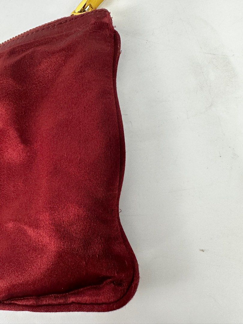 Prada Silk Pouch (Category: Luxury Bags & Wallets) located in Quezon City. Submitted by mygaragesale.ph (Listing ID 1246456852, Image 3). Description: Prada Silk Pouch Wine red. pls see photo clearly, it has some threadbare on the side and on the front logo. No dustbag. Guaranteed authentic. .