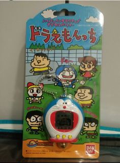 RARE, NEW AND WITH FREE TRACKED SHIPPING! Limited Edition and Out of Print 1998 Original Bandai Doraemon Tamagotchi