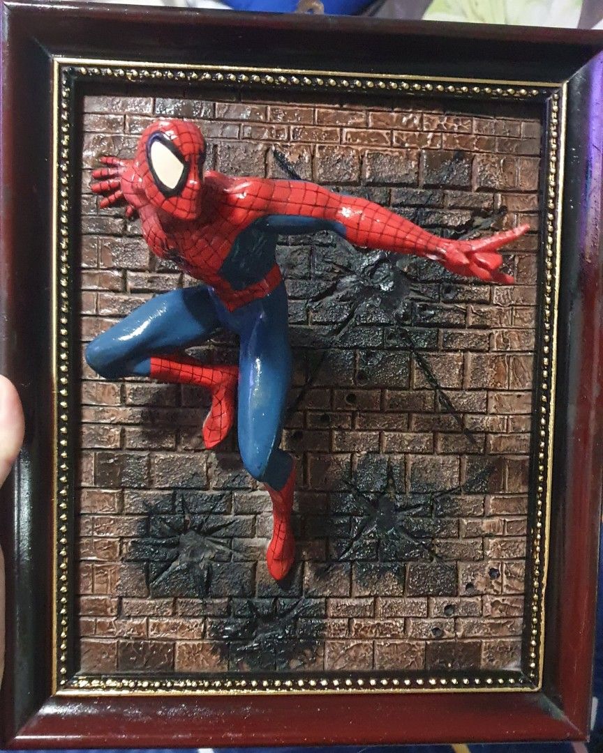 Spiderman Wall display (Category: Wall Decor) located in Cainta. Submitted by origeetostore (Listing ID 1246483199, Image 2). Description: In good condition. No markings. Bought year 2002-2003 at a collectible shop in Greenhills. Pwede niyo palitan frame or directly cement sa wall. location: Brgy San Juan Cainta Rizal Buyer will handle booking and delivery fee for grab/lalamove.