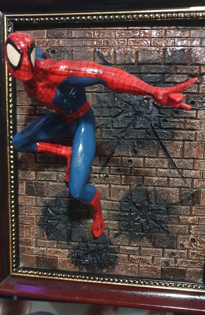 Spiderman Wall display (Category: Wall Decor) located in Cainta. Submitted by origeetostore (Listing ID 1246483199, Image 3). Description: In good condition. No markings. Bought year 2002-2003 at a collectible shop in Greenhills. Pwede niyo palitan frame or directly cement sa wall. location: Brgy San Juan Cainta Rizal Buyer will handle booking and delivery fee for grab/lalamove.