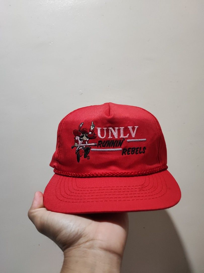 Vintage UNLV Runnin' Rebels Cap (Category: Caps & Hats) located in Makati City. Submitted by ides.ph (Listing ID 1246558180, Image 1). Description: Vintage UNLV running rebels cap Snapback one size fits all malalim ang fitting corded hat with discoloration , some portions are faded.