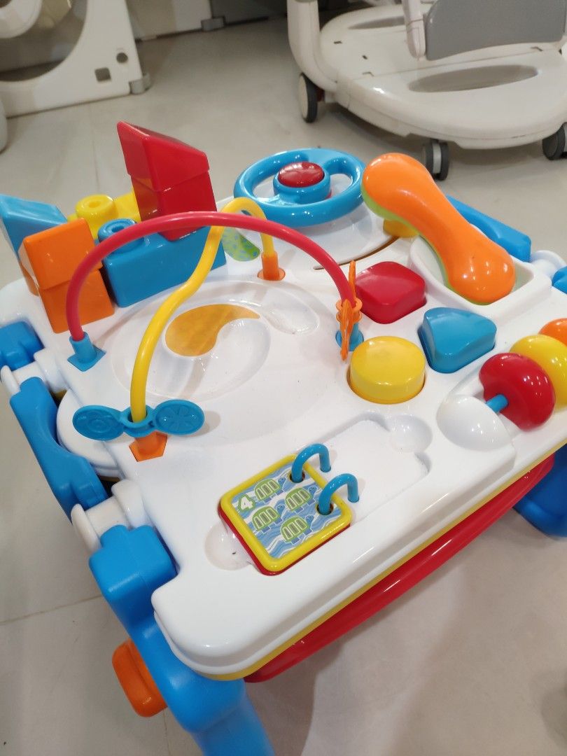 Activity Table (Category: Infant Playtime) located in Singapore. Submitted by shoestringbudget (Listing ID 1248182076, Image 4). Description: Activity table with some mega Lego blocks and shapes. Good height for babies that are just standing, keeps them entertained.