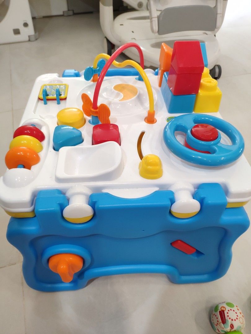 Activity Table (Category: Infant Playtime) located in Singapore. Submitted by shoestringbudget (Listing ID 1248182076, Image 2). Description: Activity table with some mega Lego blocks and shapes. Good height for babies that are just standing, keeps them entertained.