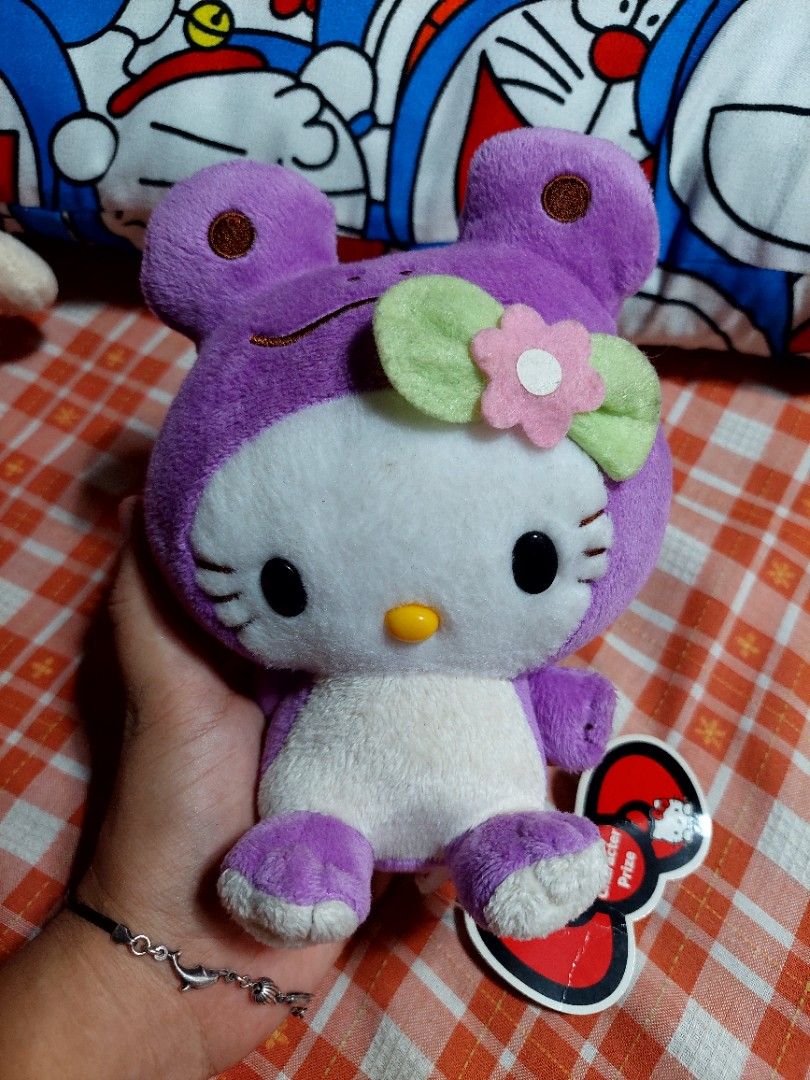 Hello kitty purple frog suit on Carousell