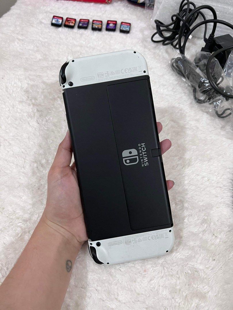 NINTENDO SWITCH OLED (Category: Nintendo) located in Paranaque City. Submitted by macy_s (Listing ID 1248322589, Image 3). Description: NINTENDO SWITCH OLED- 25,000 (negotiable) INCLUSIONS: -Box -HDMI -Charger -Docking Station -Controllers -Straps -Grip -6 Games >Instant sport summer games >Dragon ball Z >Fire emblem warriors three hopes >Demon slayer the hinokami chronicles >Pokemon legends arceus >Pokemon sword NO ISSUES, NO DENTS OR SCRATCHES.