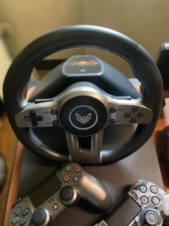 PS4 500gb WITH STEERING WHEEL