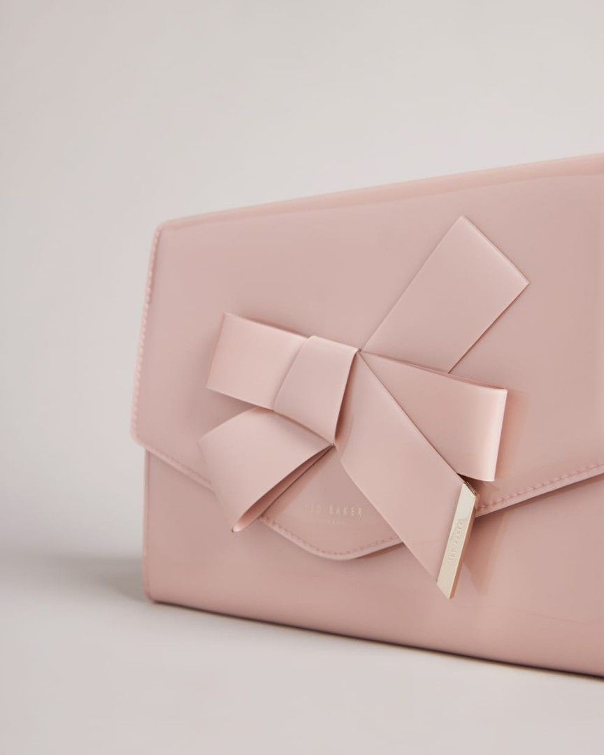 Ted Baker Nikkey (Category: Luxury Bags & Wallets) located in Cavite. Submitted by chinosumo (Listing ID 1248436287, Image 3). Description: Envelope pouch bag Popper fastening Knot bow embellishment Wrist carry strap Ted Baker branded Dimensions: W26cm x H18cm x D2.5cm Selling for 3k Last Price is 2k thats it. Used Once. Bought from Australia.