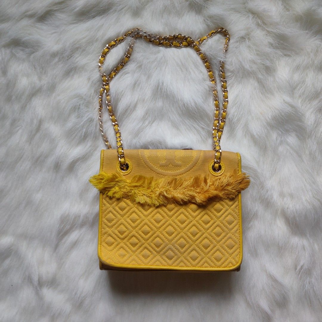 TORY BURCH | Fleming Convertible Sling Shoulder Bag (Category: Luxury Bags & Wallets) located in Cebu City. Submitted by denimholic (Listing ID 1248319970, Image 2). Description: 💼 Authentic Preloved Tory Burch Bag ▫️STYLE : Flap Canvas (body), Leather (inlay), Convertible Chain Sling ▫️SIZE : SMALL (W 9in / H 7.5in) ▫️RANK AB *need wash.