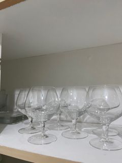 Assorted wine glasses, shot glasses, ice cream glassss, beer glasses
