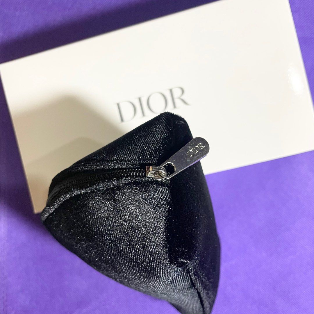 AUTHENTIC Dior black suede makeup bag trousse pouch organizer (Category: Makeup) located in Pasig City. Submitted by vanityboutique (Listing ID 1248486076, Image 3). Description: Pm for more details super spacious and has one pocket inside Size is 8 inches by 4 inches 1380 no Dior box 1430 with Dior box pls choose Brand new and authentic Selling low and affordable One of the best selling brands in the makeup skincare perfume world .