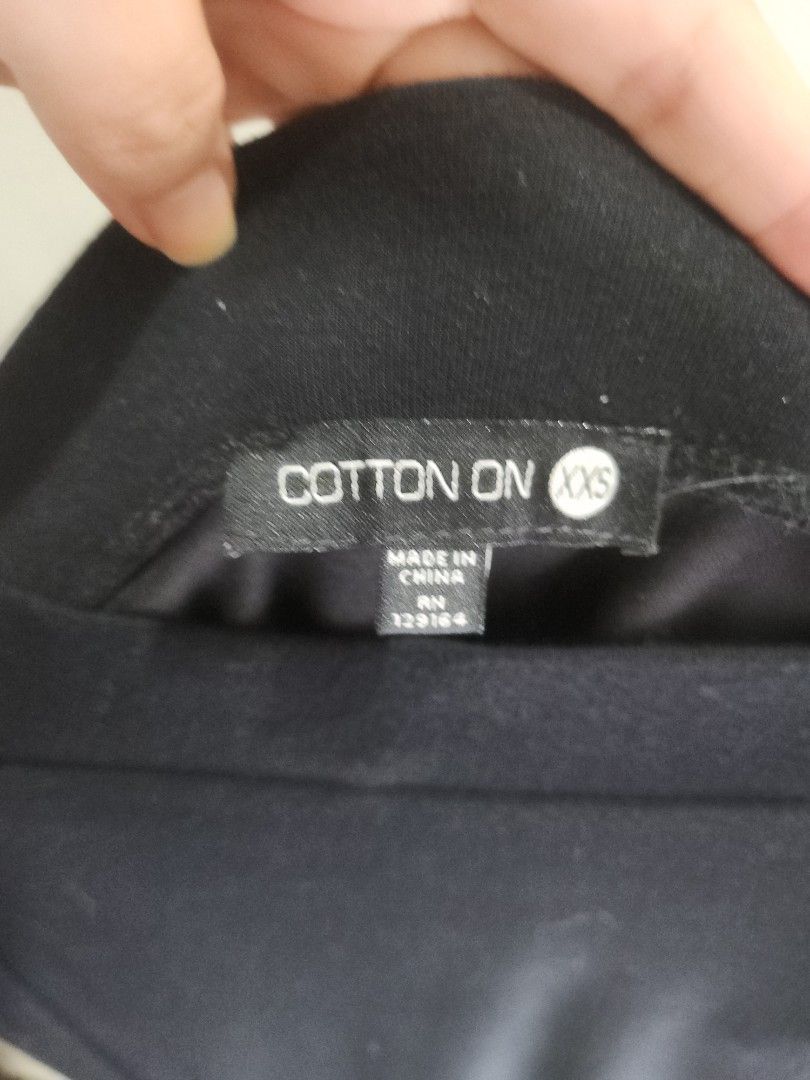 COTTON ON Black Asymmetrical Skirt (Category: Skirts) located in Quezon City. Submitted by ikcPH (Listing ID 1248611689, Image 3). Description: 🛍 Store-bought: Cotton On 🏷 Size is XXS, I'm a medium now(size 38) and it still fits me well. Worn a few times. I looooove a good figure-hugging skirt! Skirt has a nice slit / detail on one side. It's simple, but sexy and flattering at the same time. I don't mind keeping this if this doesn't get sold at