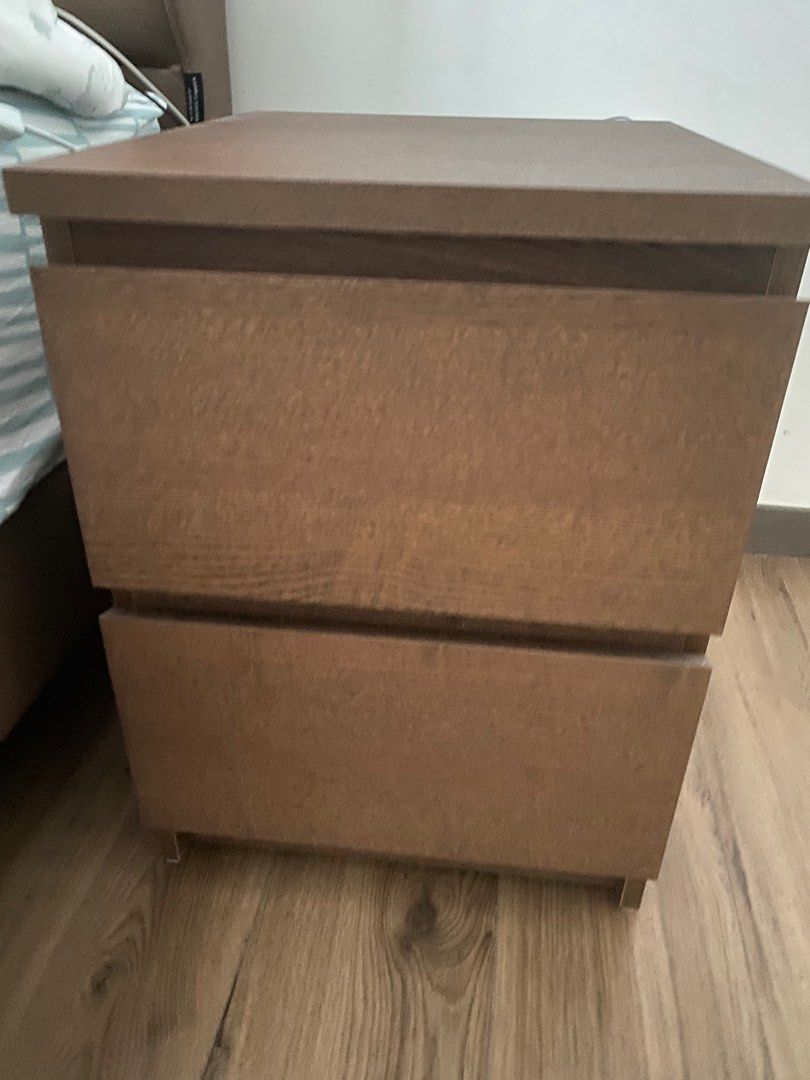 Bedside Table (Category: Other Home Furniture) located in Singapore. Submitted by donawong (Listing ID 1248785626, Image 1). Description: IKEA bedside table with 2 drawers like new. Chestnut brown color. Size: 40 cmW x 48 cmL x 56 cmH Pick up at Lake Grande Condominium @Jurong Lake Link.