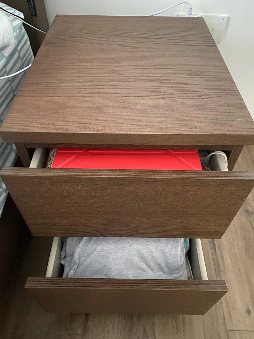 Bedside Table (Category: Other Home Furniture) located in Singapore. Submitted by donawong (Listing ID 1248785626, Image 2). Description: IKEA bedside table with 2 drawers like new. Chestnut brown color. Size: 40 cmW x 48 cmL x 56 cmH Pick up at Lake Grande Condominium @Jurong Lake Link.