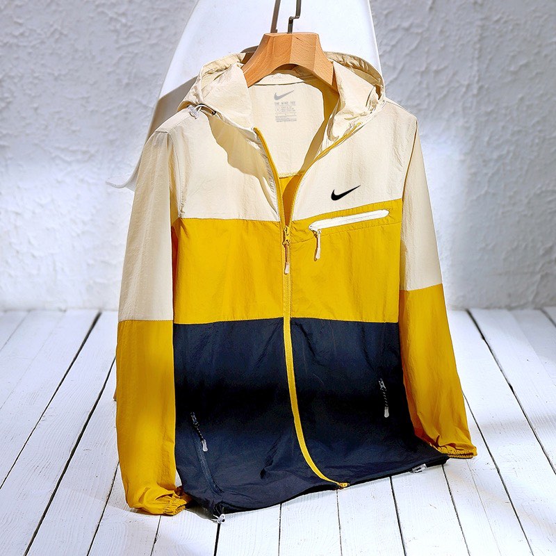 blue yellow and white nike windbreaker