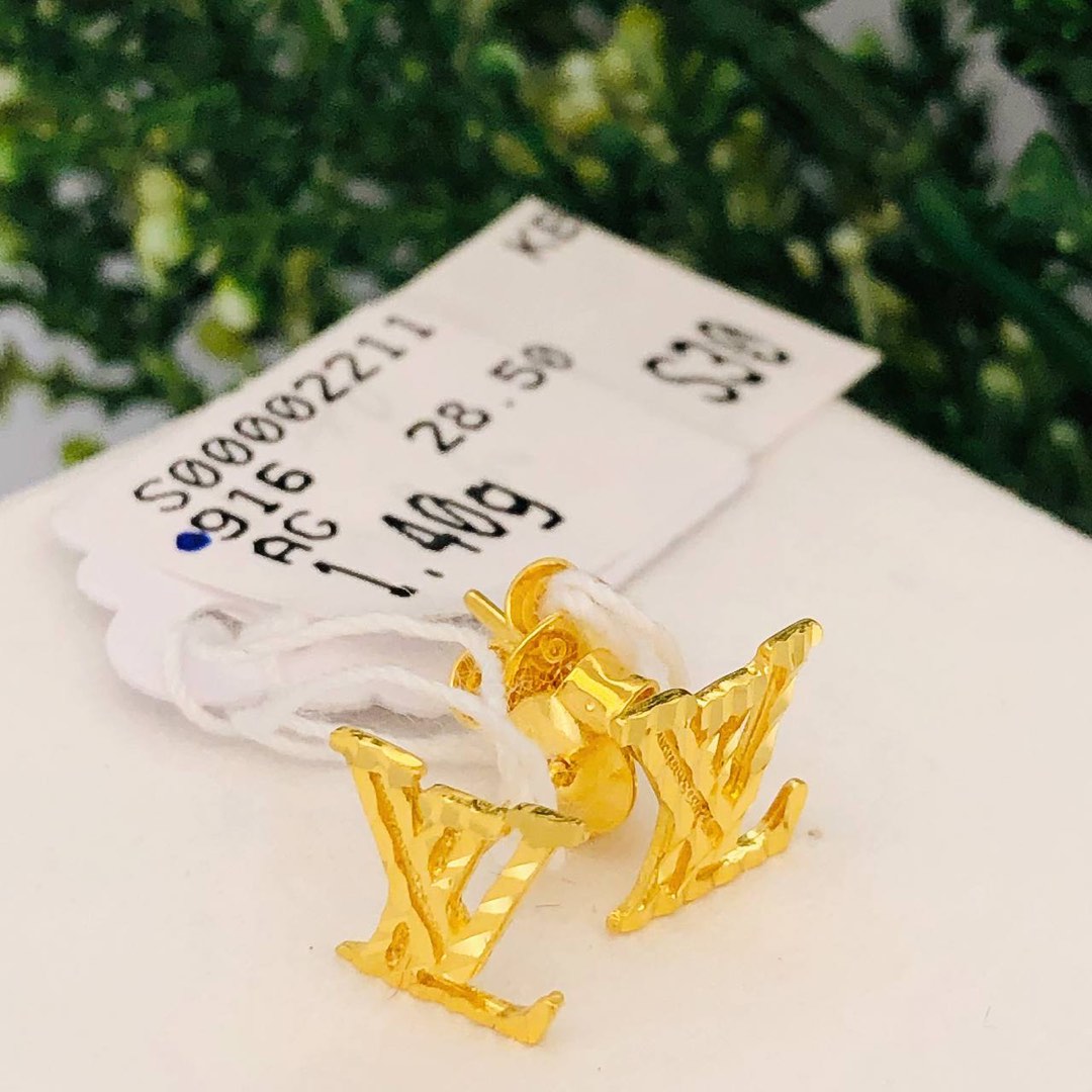 Gold louis vuitton earrings top