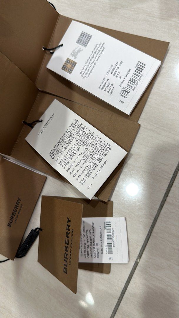 Authentic Burberry care cards and cloths tag Luxury Accessories