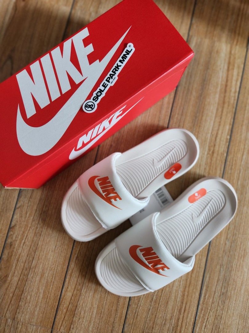 Orange and white nike slides sale