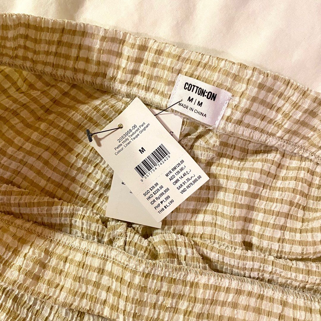 COTTON ON Cottagecore Gingham Pants (Category: Other Bottoms) located in Manila. Submitted by sanerr (Listing ID 1249209939, Image 3). Description: Selling my textured gingham pants from Cotton On. Used once or twice only to fit. Still has the tag with original price on 🫧 Bought for Php 1,599 in store Please read before buying! - Size on tag is Medium - Material is a bit see-through - Can only ship in Metro Manila (or places that the courier can