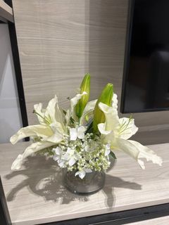 Faux flowers with acrylic vase