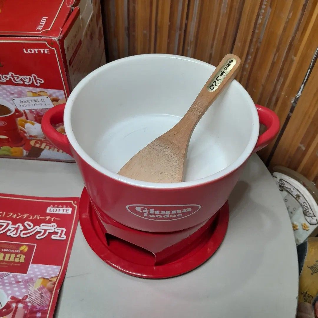 Ghana Chocolate Fondue Set (Category: Cookware & Accessories) located in Malolos. Submitted by jestrelita (Listing ID 1249093279, Image 3). Description: Ghana Chocolate Fondue Set P950 only - 1 red ceramic Ghana by Lotte (Japan Popular Chocolate Factory) bowl, unused - 1 small wooden laddie - 3 candle for melting chocolates - 2parts mini stove/stand - 6 not original but new fondue forks with wooden handle - good as new with box and manual ⛩️🇯🇵�