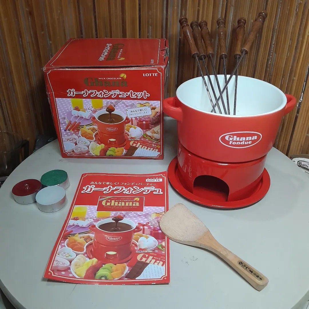Ghana Chocolate Fondue Set (Category: Cookware & Accessories) located in Malolos. Submitted by jestrelita (Listing ID 1249093279, Image 1). Description: Ghana Chocolate Fondue Set P950 only - 1 red ceramic Ghana by Lotte (Japan Popular Chocolate Factory) bowl, unused - 1 small wooden laddie - 3 candle for melting chocolates - 2parts mini stove/stand - 6 not original but new fondue forks with wooden handle - good as new with box and manual ⛩️🇯🇵�