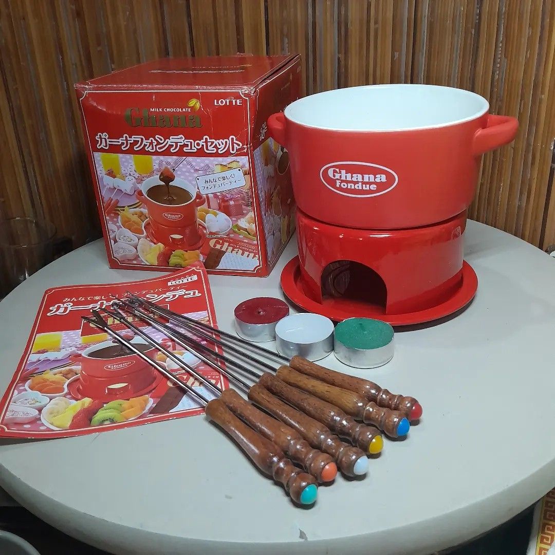 Ghana Chocolate Fondue Set (Category: Cookware & Accessories) located in Malolos. Submitted by jestrelita (Listing ID 1249093279, Image 2). Description: Ghana Chocolate Fondue Set P950 only - 1 red ceramic Ghana by Lotte (Japan Popular Chocolate Factory) bowl, unused - 1 small wooden laddie - 3 candle for melting chocolates - 2parts mini stove/stand - 6 not original but new fondue forks with wooden handle - good as new with box and manual ⛩️🇯🇵�