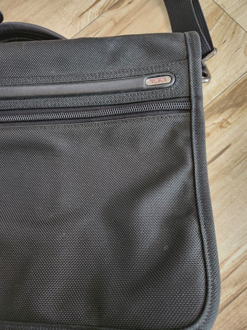 Tumi Laptop Bag (Category: Laptop Bags & Sleeves) located in San Juan City. Submitted by cocoa21043 (Listing ID 1249121453, Image 2). Description: Original Tumi Laptop bag good condition the strap padding has fading which is due to use but i think can be replaced. can be seen in last image.