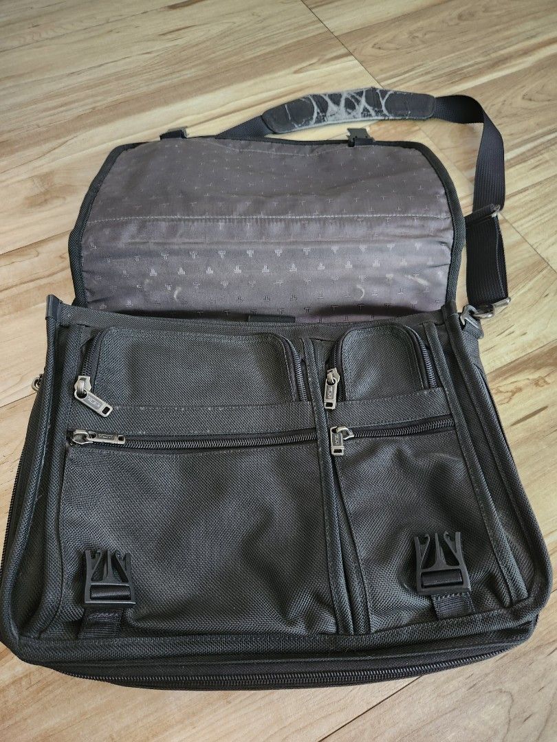 Tumi Laptop Bag (Category: Laptop Bags & Sleeves) located in San Juan City. Submitted by cocoa21043 (Listing ID 1249121453, Image 3). Description: Original Tumi Laptop bag good condition the strap padding has fading which is due to use but i think can be replaced. can be seen in last image.