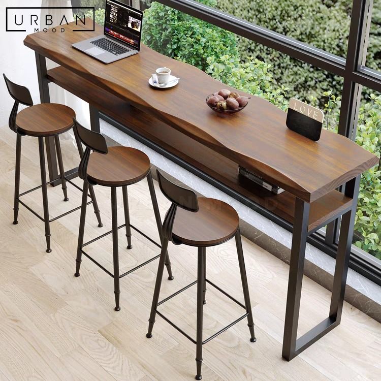 BILLY Rustic Solid Wood Bar Table (Category: Tables & Sets) located in Singapore. Submitted by collectic (Listing ID 1249307673, Image 3). Description: Shop Now: https://urbanmood.sg/products/billy-rustic-solid-wood-bar-table Redefine your bar area or outdoor lounge with our BILLY bar table. Crafted from pine wood in a beautiful matte walnut finish, its natural wavy edge adds an organic touch to your space. A convenient shelf beneath offers stora