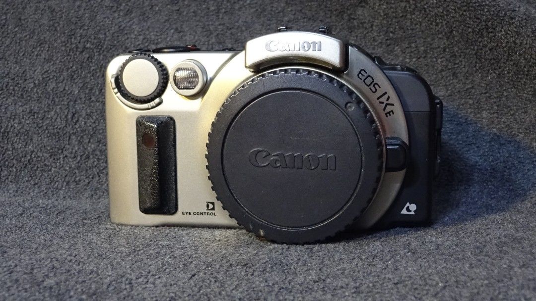 Canon IXE APS Film SLR Camera (Category: Cameras) located in Paranaque City. Submitted by kutoi.ancheta (Listing ID 1249430428, Image 1). Description: Canon IXE APS Film SLR Camera made in Taiwan ₱3000 Canon EF Mount uses 2 CR123A batteries (excluded) condition: fresh! all working and functional! pros reflex mirror - good shutter release - good menu, modes - good functioning selector dial, good film chamber, good battery terminals, good small spe