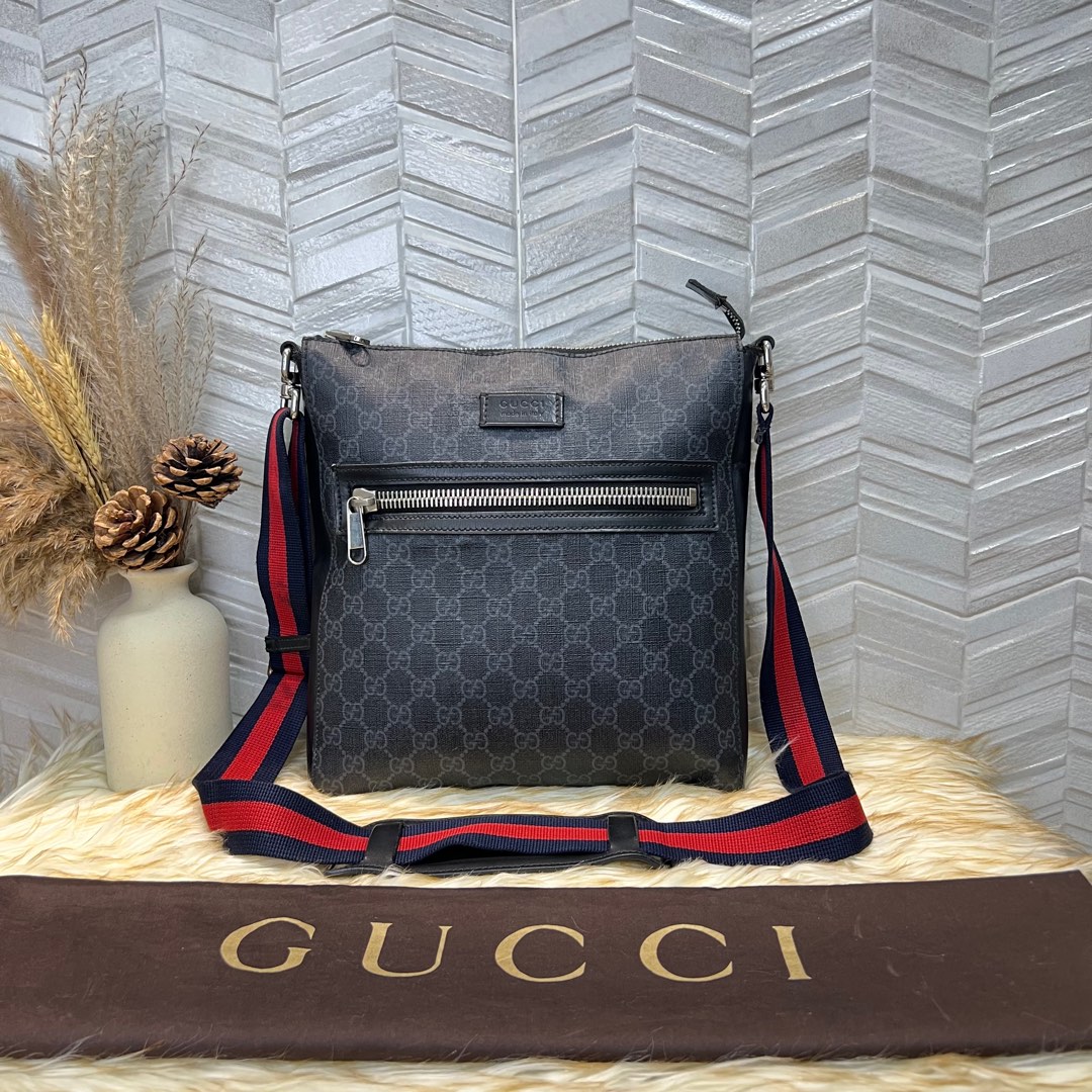 Gucci supreme sling backpack discount