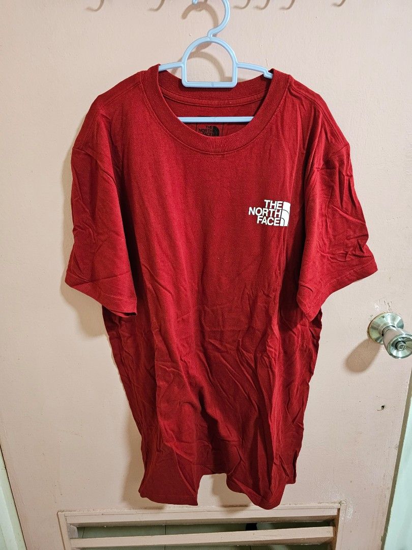 Red north face top shirt