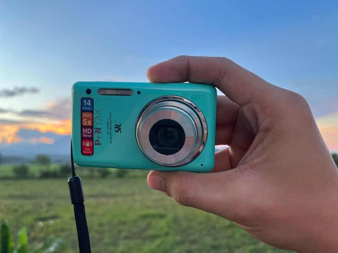 Pentax Optio S1 14MP Compact Digital Camera (Category: Cameras) located in Manila. Submitted by mmeowsz (Listing ID 1249385920, Image 2). Description: ✨Pentax Optio S1 14MP Compact Digital Camera ⤷ ₱5,500 ⤷ no issue ⤷ fully functional ⤷ inclusions: unit, battery, universal charger, strap, sd card, leather case • High Resolution 14MP Sensor • 5x Wide-Angle 28-140mm Optical Zoom Lens • 1280x720p HD Video • Bright 2.7" LCD Monitor Screen • Shake Red