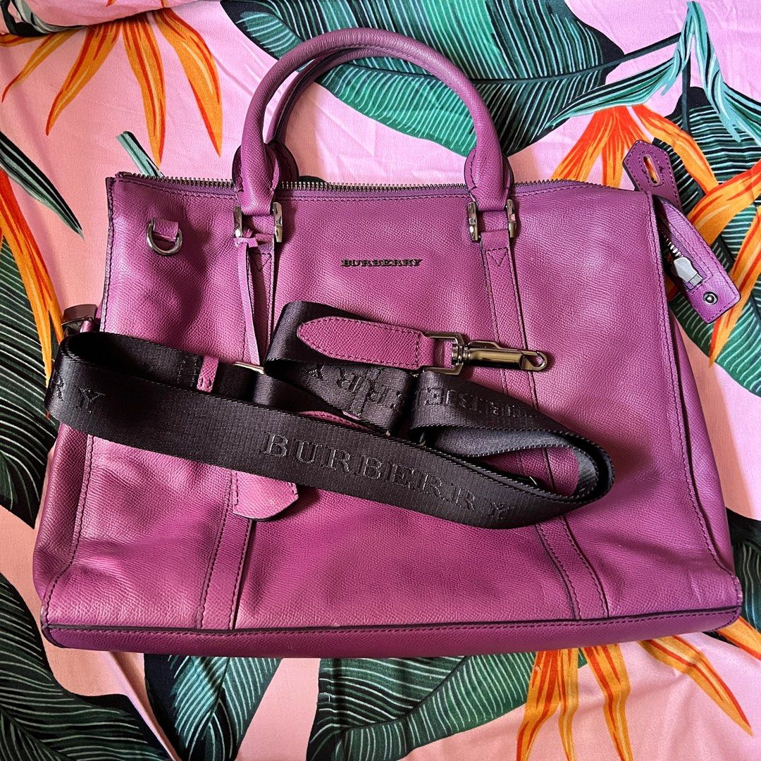 Burberry Laptop Bag (Category: Laptop Bags & Sleeves) located in Marikina City. Submitted by clarisse0802 (Listing ID 1249471033, Image 3). Description: Leather laptop bag with strap Plum - berry color 15 x 11 inches Very presentable and luxurious Leather is in good condition Bought online, pls self authenticate See flaw on last photo - needs to be sewn.