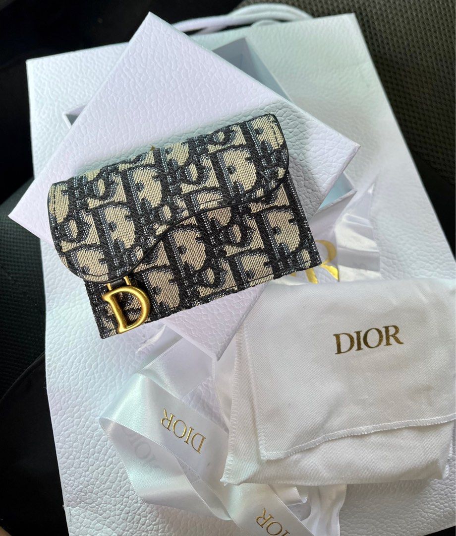 Dior Saddle Flap Card Holder (Category: Luxury Bags & Wallets) located in Manila. Submitted by folklore.ml (Listing ID 1249623612, Image 1). Description: Brand new Comes complete Ok pick up/lalamove Marikina Rfs declutter, no longer needed.