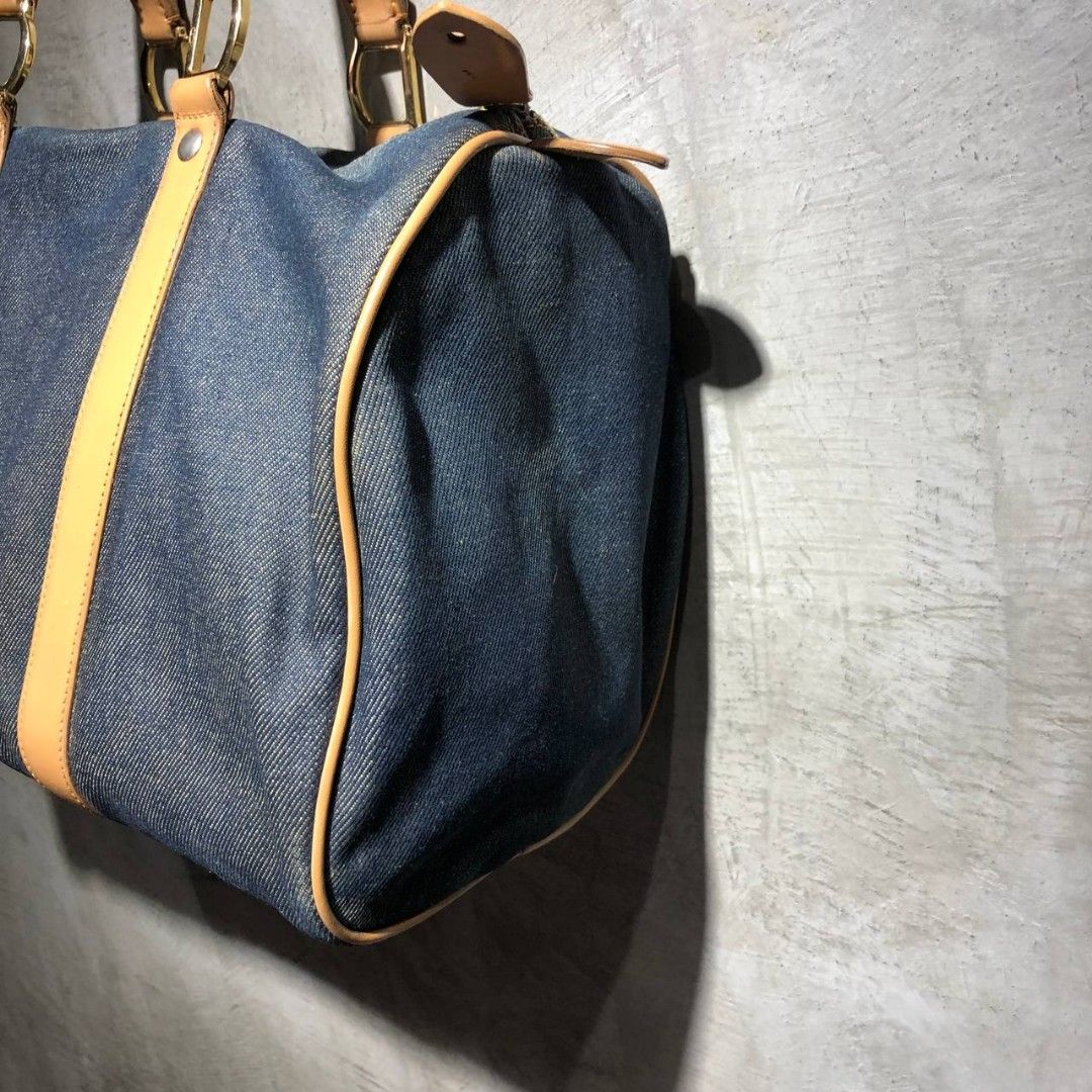 Dior Speedy 25 Denim Hand Bag (Category: Luxury Bags & Wallets) located in Quezon City. Submitted by johnpaulperezzz (Listing ID 1249525769, Image 3). Description: Dior Speedy 25 Denim Hand bag With Authenticity Card size: OS dimension: Width: 14" Length: 9" Depth: 8" Condition: 8/10 Issue: - Repainted Handle - Paint stain Price: 12.5k.